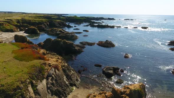 Stunning Coastal Beaches of California with Scattered Rocks in Waters