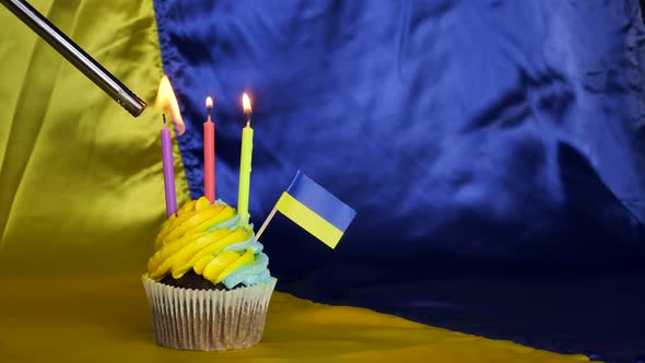 Cupcake with the Ukrainian Flag on the Background of the Flag of Ukraine