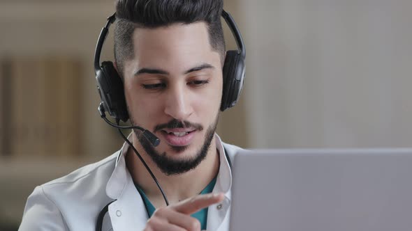 Professional Male Arab Hispanic Young Doctor Assistant in Medical Coat Wear Headset with Microphone