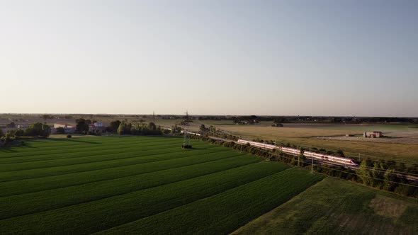 Passage of an Italian high-speed passenger train in the countryside.