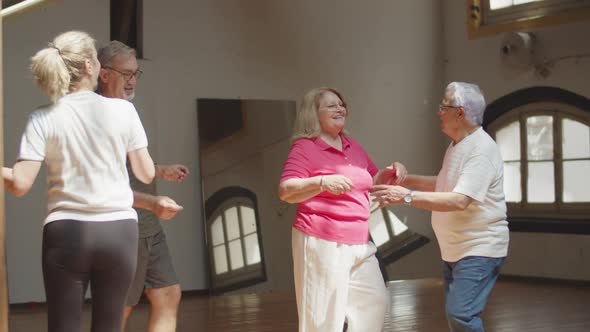 Long Shot of Senior Couples Having Dance Class in Ballroom