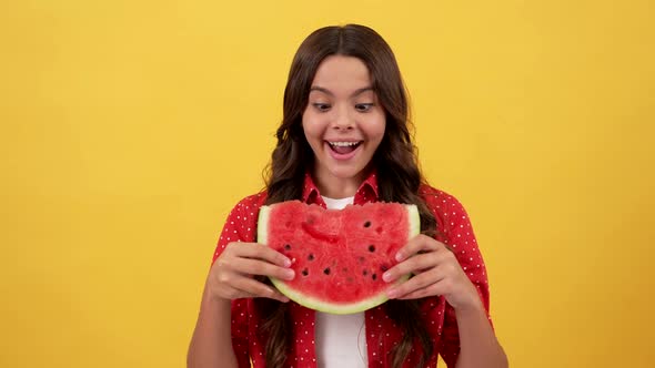 Smiling Child Going to Eat Water Melon Slice on Yellow Background Hunger