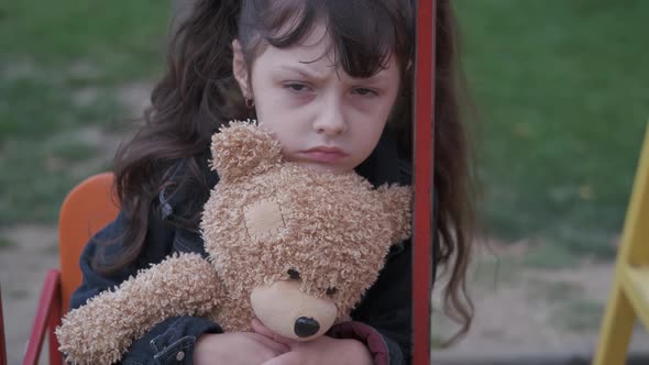 Depressed girl on the swing. 