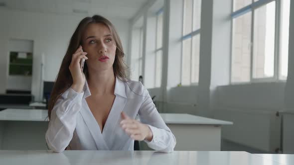 Close Up View of Young Woman Who Talks on Her Phone