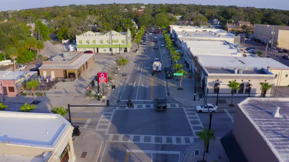 Forward Aerial of Cars on the Main Road in a Small Town in Florida