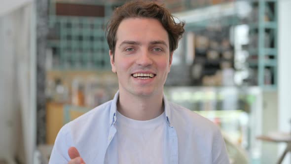 Portrait of Young Man Talking on Online Video Call