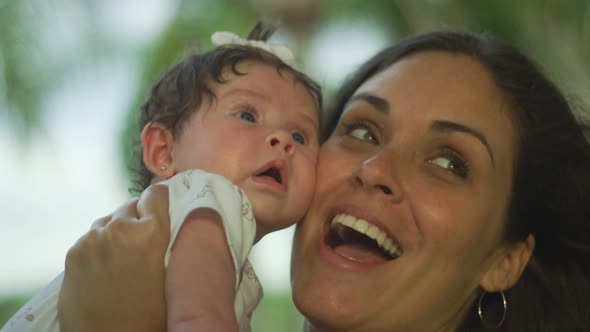 Slow Motion of Woman Holding Her Baby and Smiling