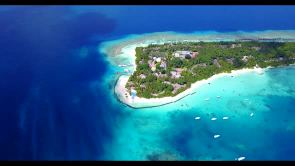 Aerial flying over panorama of beautiful island beach lifestyle by transparent ocean and bright sand