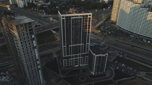 City block construction site. Multi-storey buildings. City landscape at sunrise. Aerial photography.