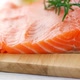 Fresh raw salmon fillet on wooden board, dolly shot - VideoHive Item for Sale