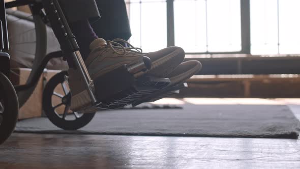 Sneakers on Feet of Handicapped Person