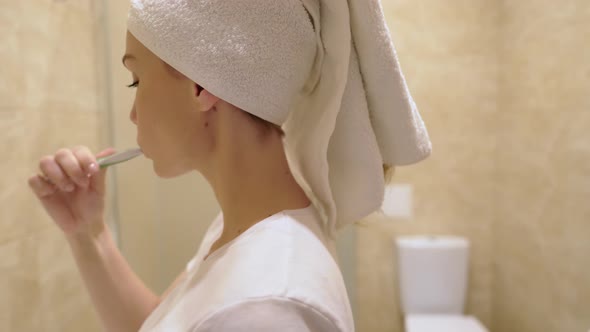 Attractive Woman Brushing Teeth.