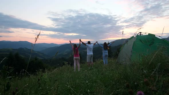 A Group of Tourists Resting in the Mountains of the Swiss Alps They Set Up a Tent