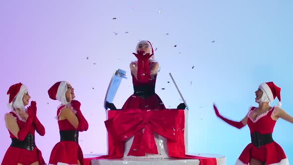 Hot Sexy Snow Maiden Emerges From a Large White Cake with a Present in Her Hands