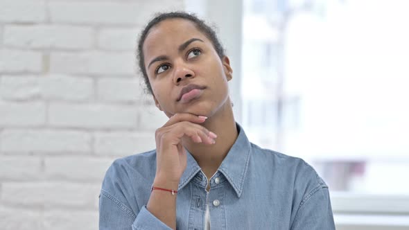 Pensive Young African Woman Thinking New Idea