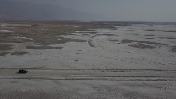 Aerial Drone Shot Following Vehicle in Desert Death Valley