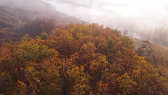 Aerial Drone View of Sunrise Over Misty River