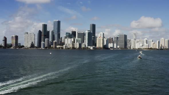 View at Miami's Embankment and Sailing Boats on Blue Sky Background