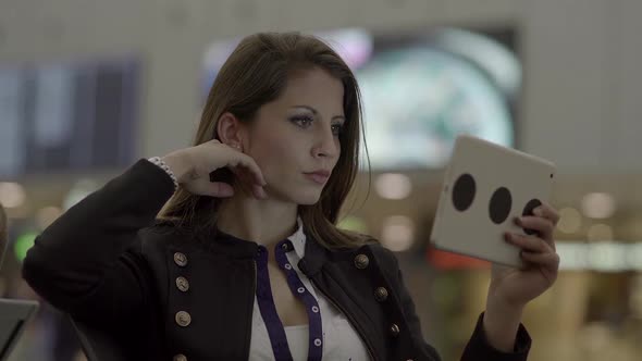 Attractive Female Person Browsing the Internet on Tablet Computer