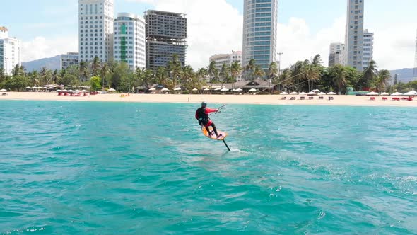 Aerial View of the City Beach and Active People Practicing Kite Surfing and Windsurfing. Kitesurfing