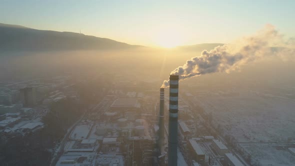 Smoking Factory Chimneys in the Background of the City at Sunset. Sofia, Bulgaria