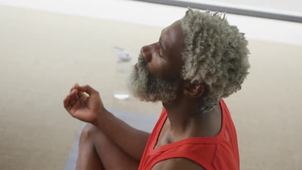 Video of african american senior man meditating