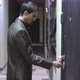 A Young Handsome Businessman Unlocks a House's Door with Key and Enters - VideoHive Item for Sale