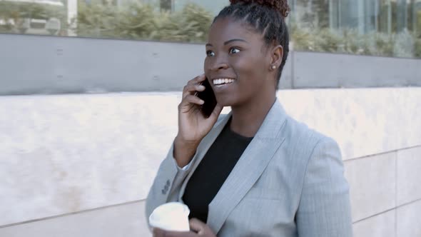 Happy African American Businesswoman Walking Outside