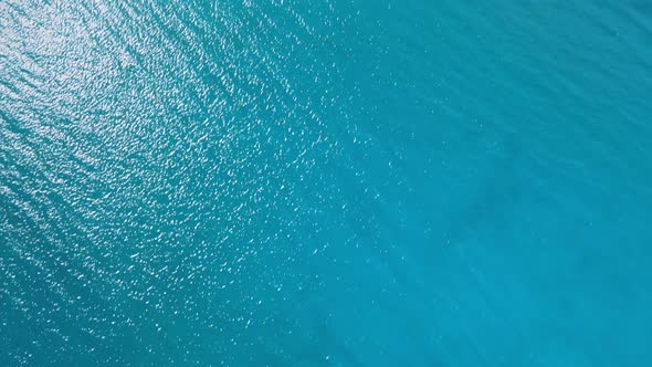 aerial drone footage looking Straight down of boats moored in the turquoise water of Lake Tahoe