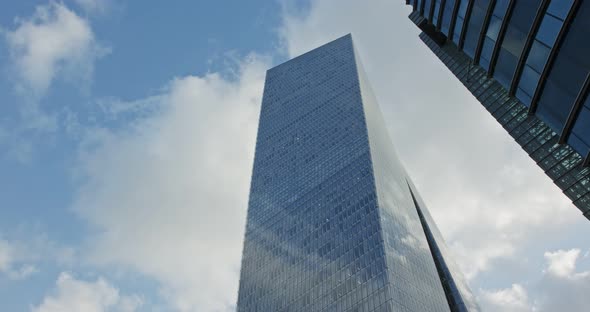 Timelapse of modern glass skyscraper in Tel Aviv, Israel with cloud relfections
