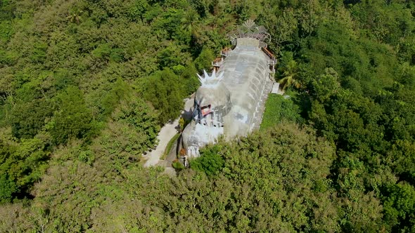 Gereja Ayam or Chicken Church immersed in lush forest, Magelang in Indonesia. Aerial drone view