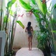 Back View Sexy Girl Alone In Exotic Shower Bathroom Luxurious Resort with Plants - VideoHive Item for Sale