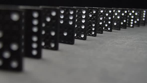 Domino Effect White On Black Dominos Falling In Succession Chain Reaction