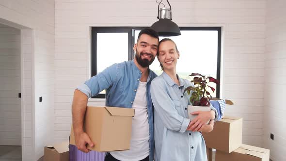 Caucasian Couple Wear Blue Shirt Stand, Smile in New House.