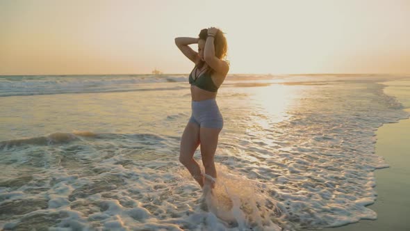 Athletic Woman Working Out At The Beach