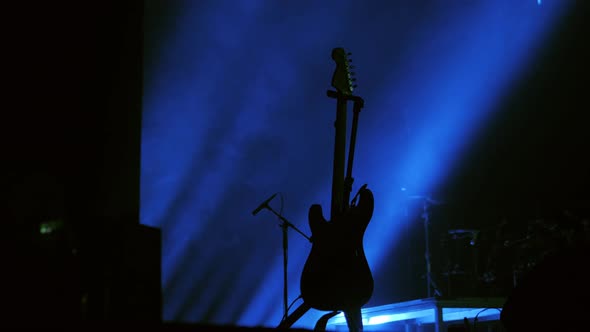 Empty Stage with Instruments Ready for Performance Drums Set Guitars Bass and Music Desk Fog Smoke