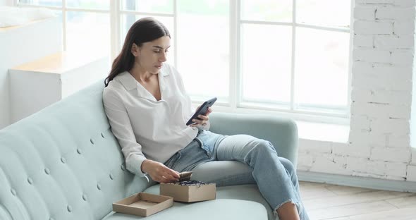 Young Woman Feeling Satisfied with the Delivered Purchase