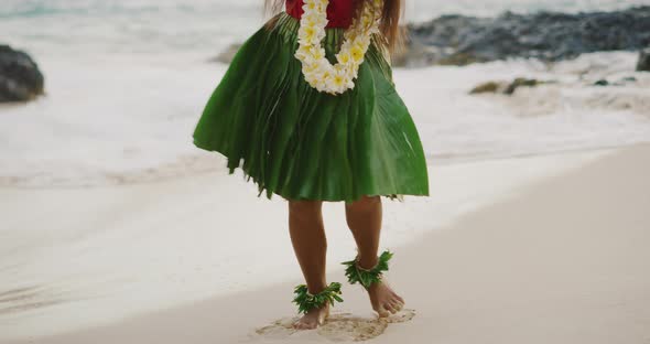 Woman performing Hawaiian hula on the beach