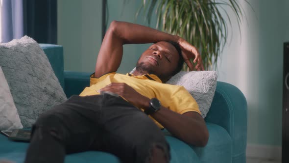 Black Guy Sleeping on Sofa