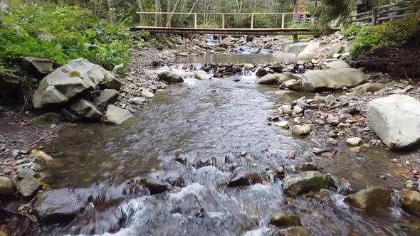 Mountain river, water flowing on the slopes and fireplaces from the top of the mountains.