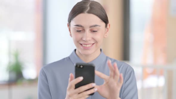 Portrait of Young Latin Woman Using Smartphone