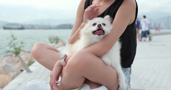 Woman hugging her dog at outdoor