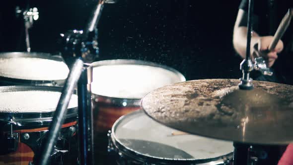 Percussion Instruments, Close Up. Professional Drummer Hits Cymbals with Water.