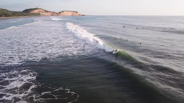 Surfer Riding The Waves With Stunning Ocean Water In Olon Beach, Ecuador During Summer. - Pullback S