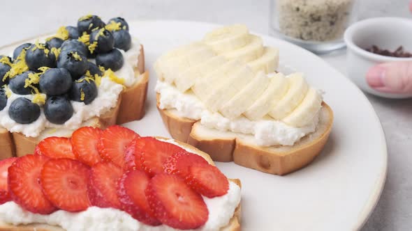 Cooking fruit vegetarian toasts for breakfast.