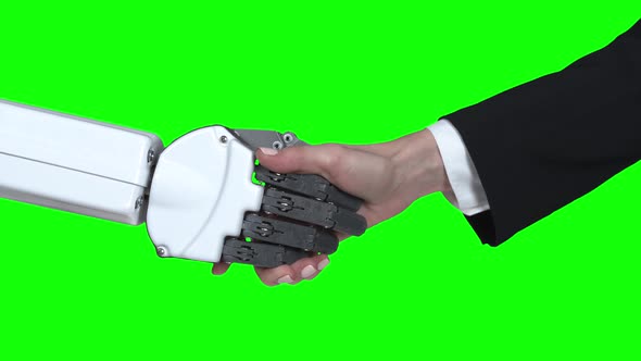 Handshake Hands of Robot and Girl Hands. Green Screen. Close Up