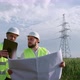 Power engineers working with a drawing. - VideoHive Item for Sale