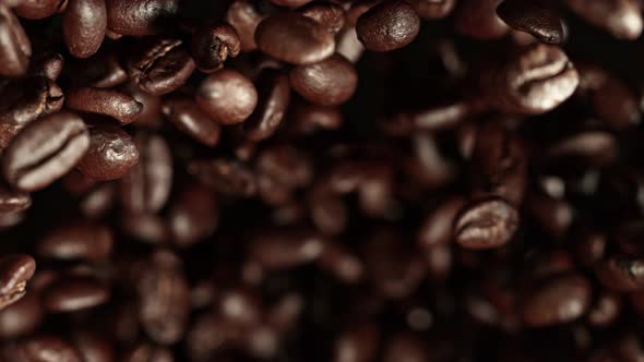 Super Slow Motion Shot of Exploding Premium Coffee Beans Towards the Camera at 1000Fps