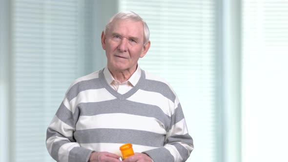 Elderly Man with Medication Blurred Background.