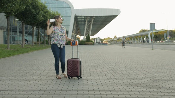 Coronavirus Pandemic, Covid-19 Ended, Woman Tourist Takes Off Medical Mask. Dance, Celebrate